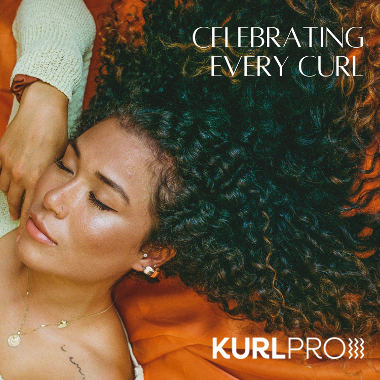 Woman with voluminous, naturally defined dark curly hair lying down on an orange fabric backdrop, featuring the Kurl Pro logo and text "Celebrating Every Curl".