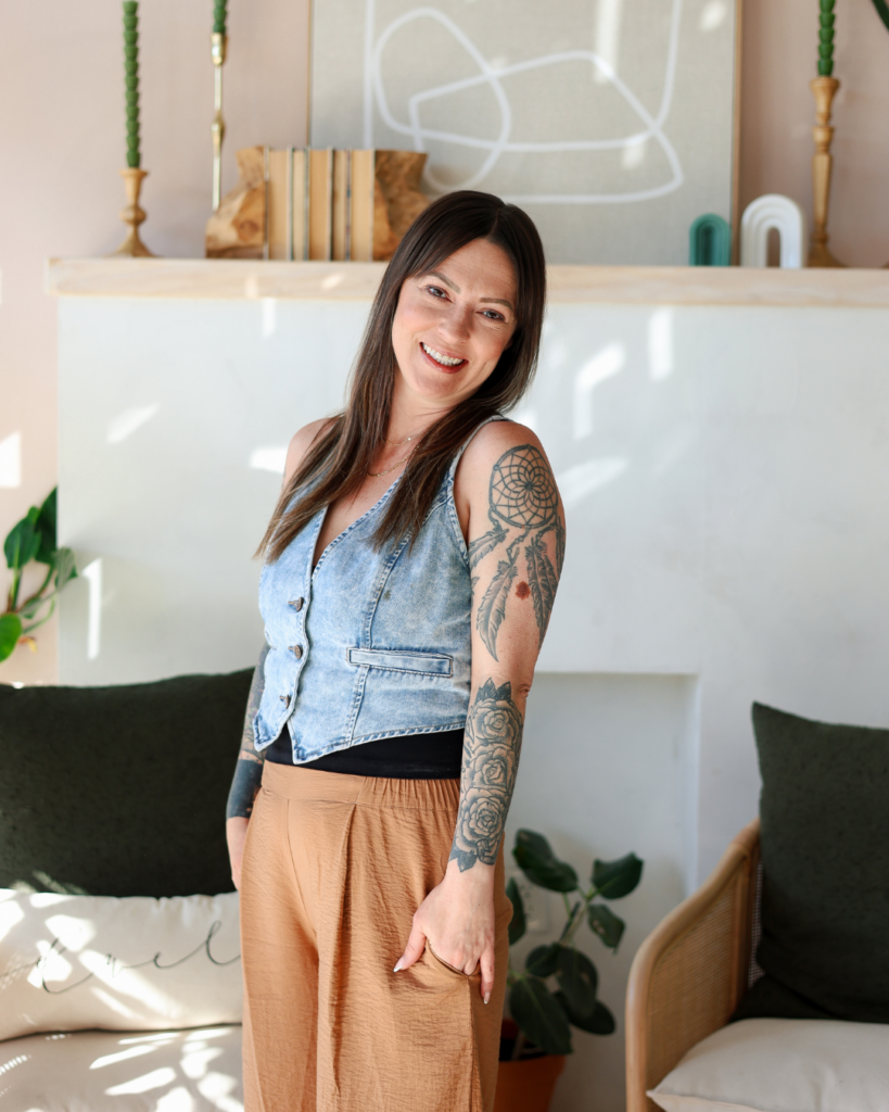 Master hairstylist Ashley McRaney smiling in her Fort Worth salon studio.