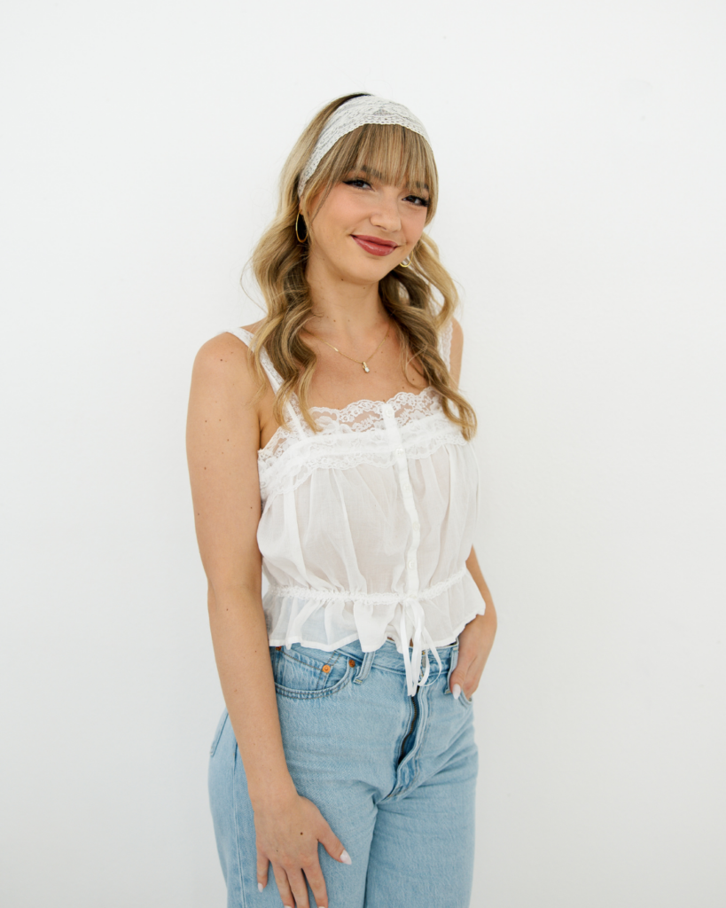 Hairstylist Zoe Sapp with lace headband and white top in Fort Worth TX.